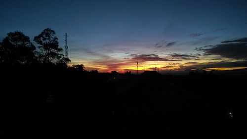 Scenic view of silhouette landscape against sky at sunset