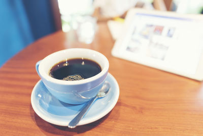 High angle view of coffee cup on table