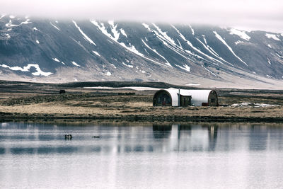 Scenic view of lake with mountains in background