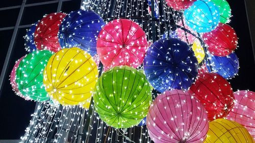 Low angle view of multi colored balloons