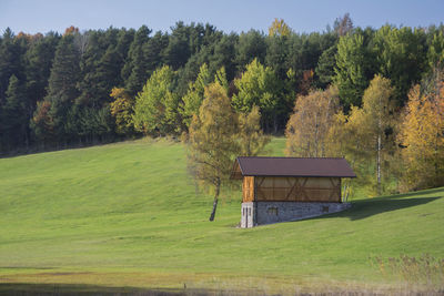 Built structure on land against trees