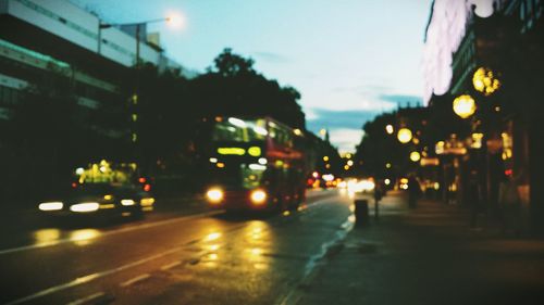 Cars on city street at night