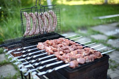 Close-up of meat on barbecue grill