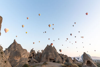 Low angle view of balloons against sky