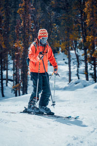 Full length of person skiing on snow covered land