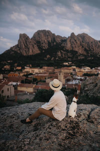 Rear view of man standing on mountain