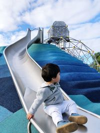 Full length of boy on slide