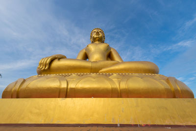 Low angle view of statue against sky