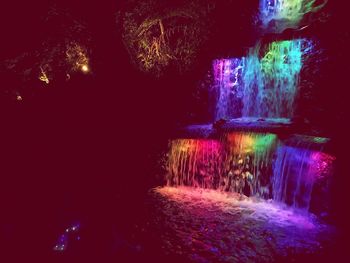 View of illuminated waterfall at night