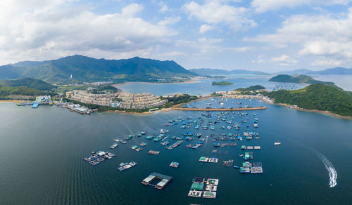 High angle view of boats in sea against sky