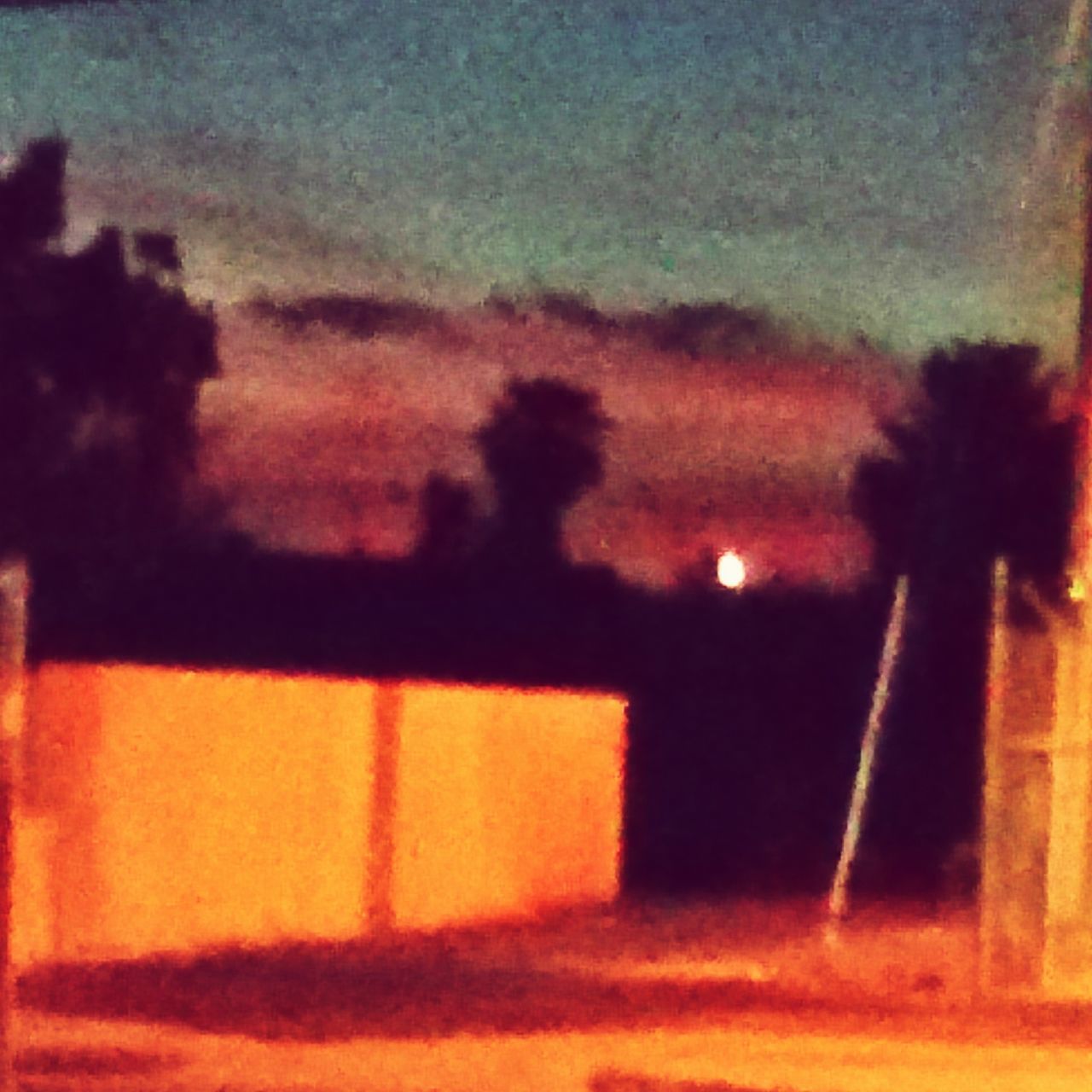 DEFOCUSED IMAGE OF ORANGE SKY AT SUNSET