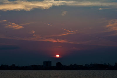 Scenic view of sea against romantic sky at sunset