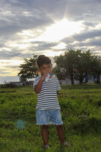 Full length of girl standing on field