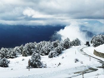 Scenic view of snowcapped mountains against sky