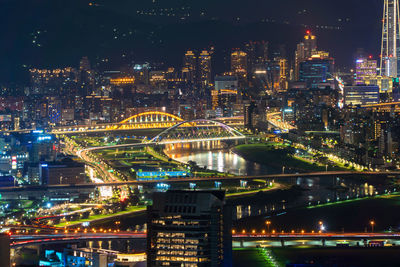 Illuminated buildings in city at night