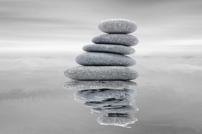 Stack of pebbles in sea