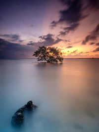 Scenic view of sea against sky at sunset