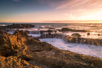 Scenic view of sea against sky during sunset