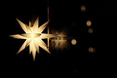 Close-up of illuminated christmas lights at night