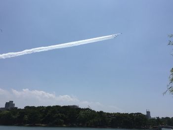 Low angle view of vapor trails in sky