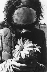 Close-up of woman with flower