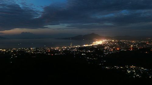 Aerial view of illuminated cityscape at night