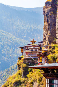 View of buildings against mountain range