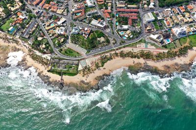 High angle view of buildings by sea