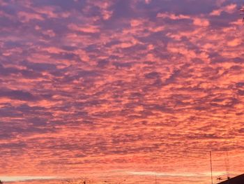 Low angle view of dramatic sky during sunset