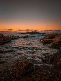 Scenic view of sea against sky during sunset