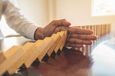 Close-up of man preparing food on table