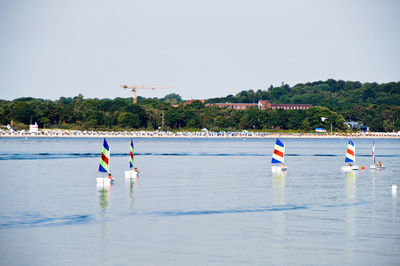 Children enjoying in sailboat at sea