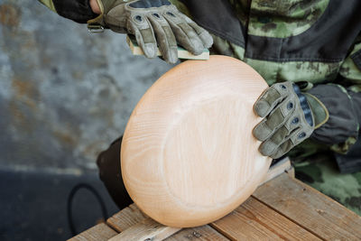 Close-up of person working on wood
