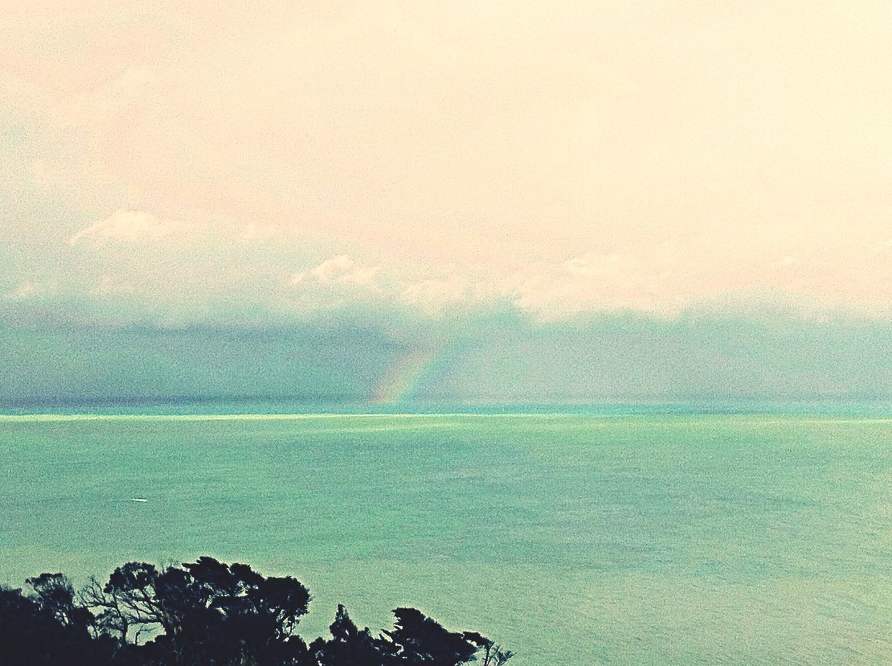 SCENIC VIEW OF RAINBOW OVER SEA