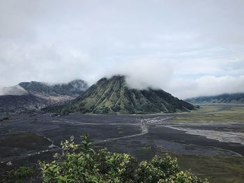 Scenic view of volcanic landscape against sky