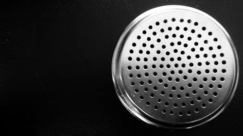 Directly above view of drainage on black background