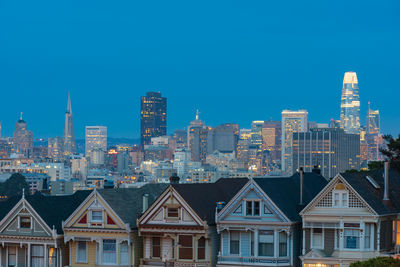 Modern buildings in city against clear sky