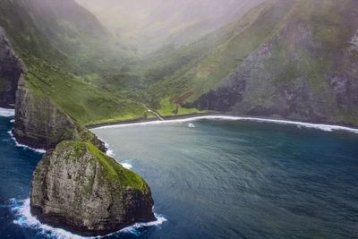 Scenic view of rocks by sea