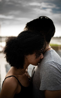 Side view of young woman looking away