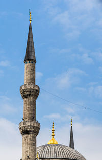 Low angle view of bell tower against sky