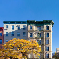 Low angle view of building against clear blue sky