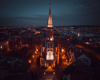 Illuminated buildings in city at night