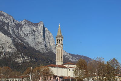 Tower of buildings against clear blue sky