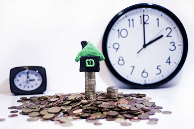 Close-up of coins on table against white background