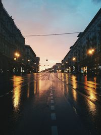 Illuminated city street at night