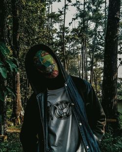 Person wearing mask in forest