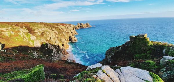 Panoramic view of sea and rocks against sky