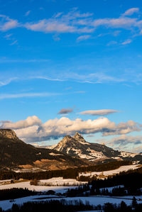 Scenic view of snowcapped mountains against sky during winter