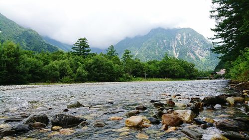 Scenic view of river and mountains
