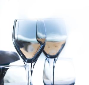 Close-up of wineglass against white background